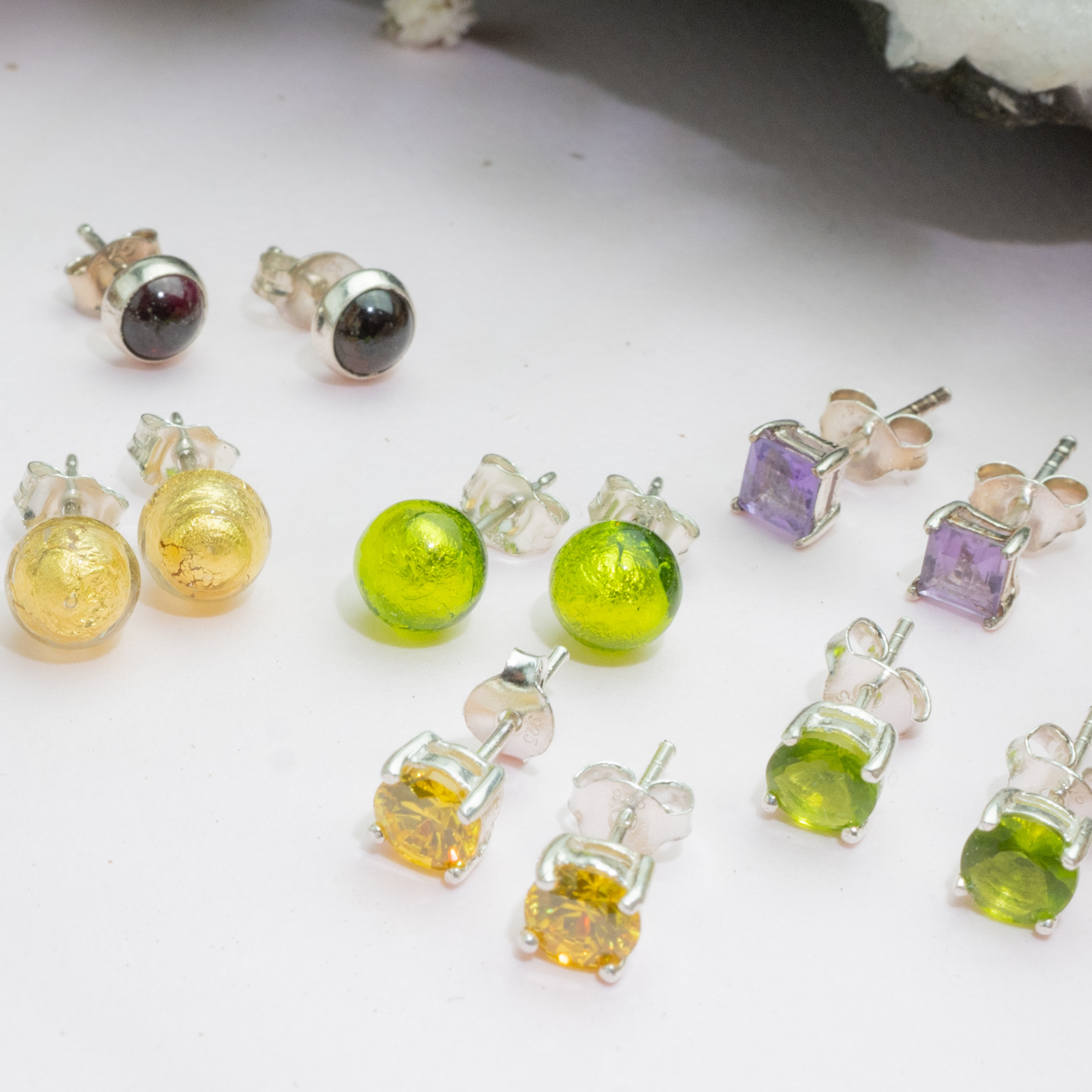 2024 Fall collection of earrings in greens, golds and purples