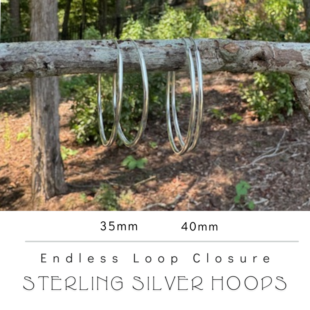 Comparison of 35mm and 40mm sterling silver hoop earrings to visualize size difference.