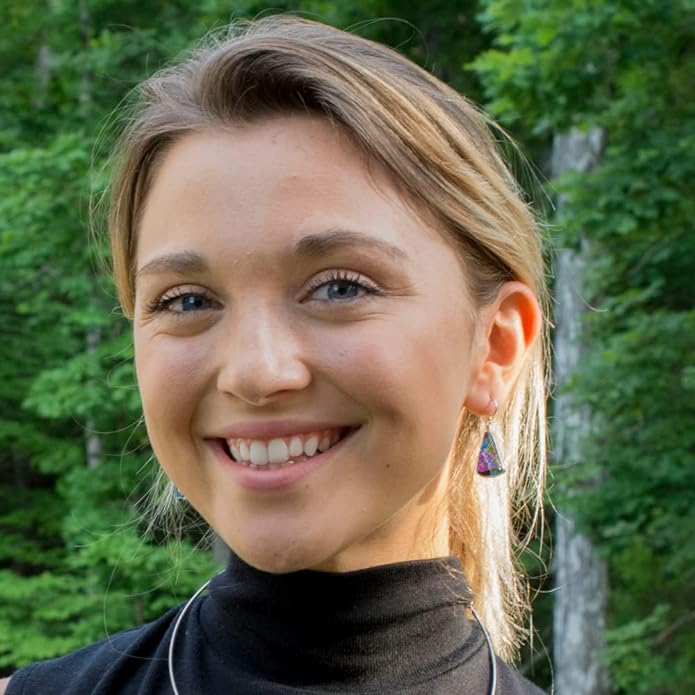 Window Waterfalls Kaleidoscope dangle earrings on a model in a black turtleneck