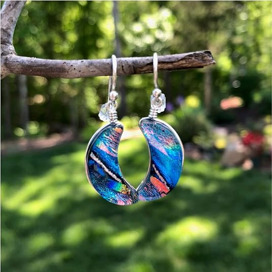 Blue Moon Dichroic Glass Earrings on branch in the dappled sunlight.