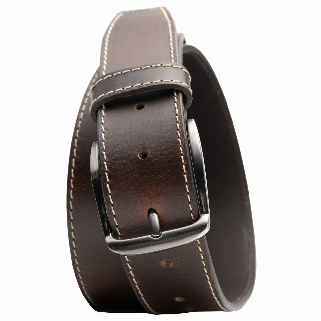 Silver nickel free buckle sewn onto medium brown leather with sewn edge of cream colored stitching