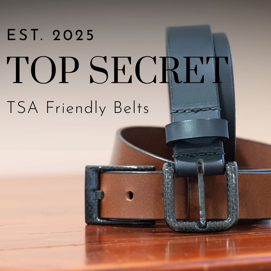 Est. 2025. Top Secret. TSA Friendly Belts. Two belts on wooden surface.