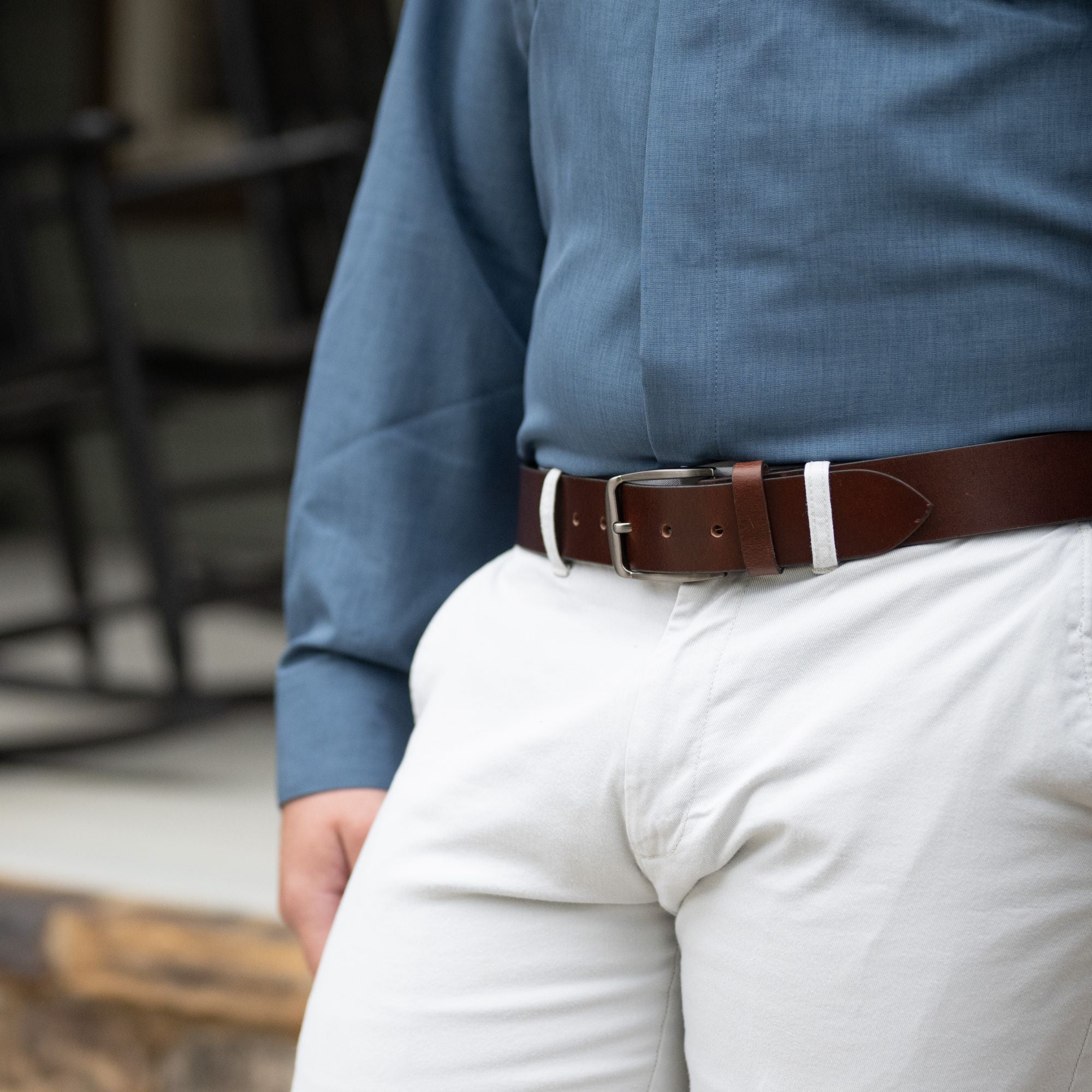 Millennial Brown Leather Belt on a male model in khakis and a blue button up shirt.