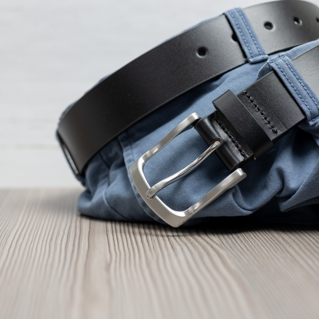 Urbanite Black Leather Belt looped through a pair of jeans