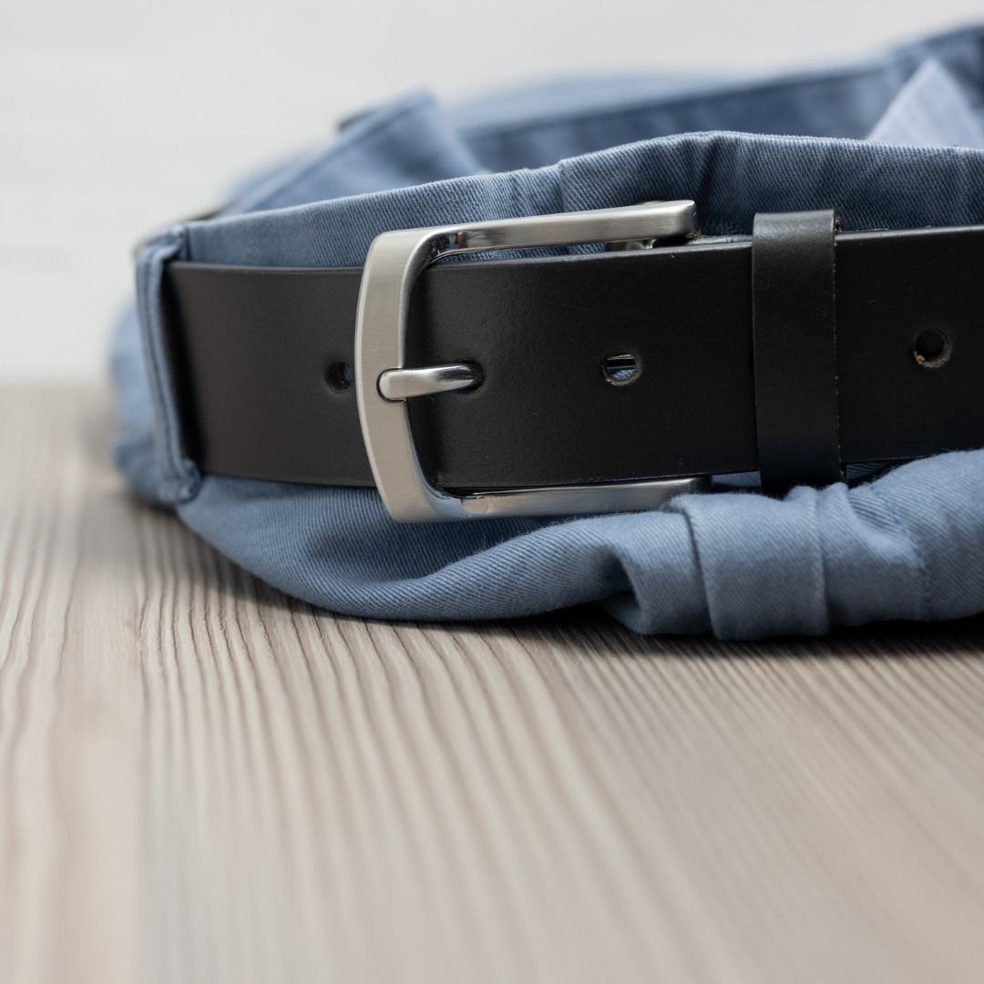 Urbanite Black Leather Belt latched and styled on a pair of jeans