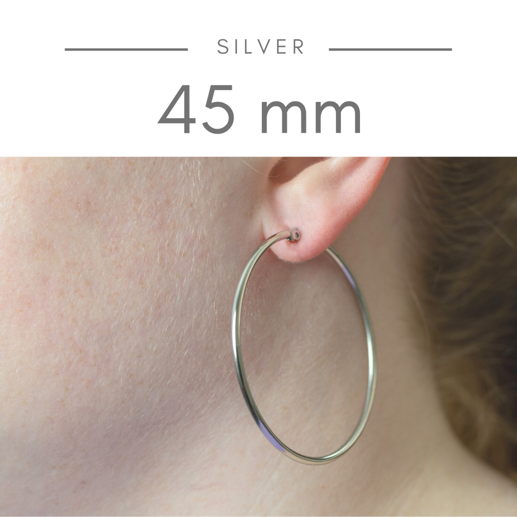 Stainless Steel Hoop Earrings - Silver 45mm on model. Large silvery stainless steel in a thin hoop.