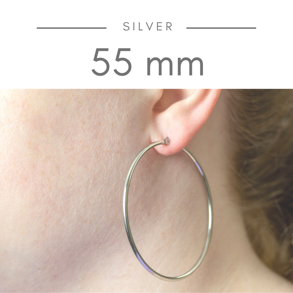 Stainless Steel Hoop Earrings - Silver 55mm on model. Extra-large silver hoops. Versatile style.