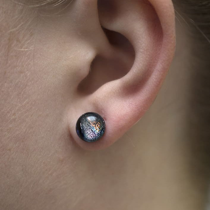 Galaxy Quest Earrings on model. No rash! Circular earrings are 4-6mm, smaller than earlobe.