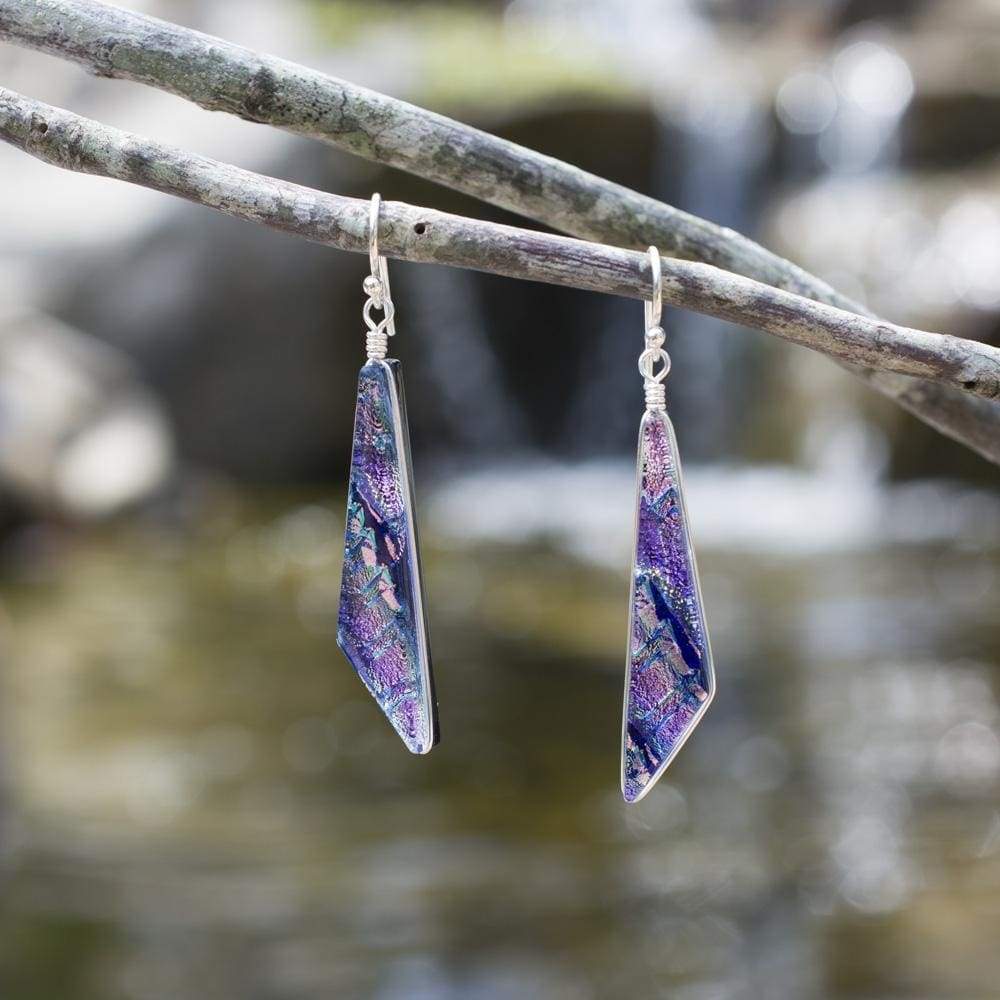 Queen Falls Earrings. Outdoor setting. Colors shine in the sun; mostly purple with other accents.