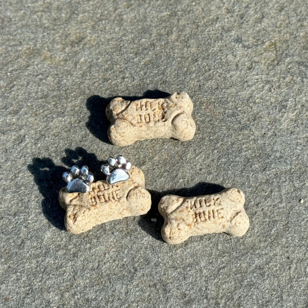 Pawsitively Perfect Earrings with small milk bones. Each stud is one paw print. Hypoallergenic.