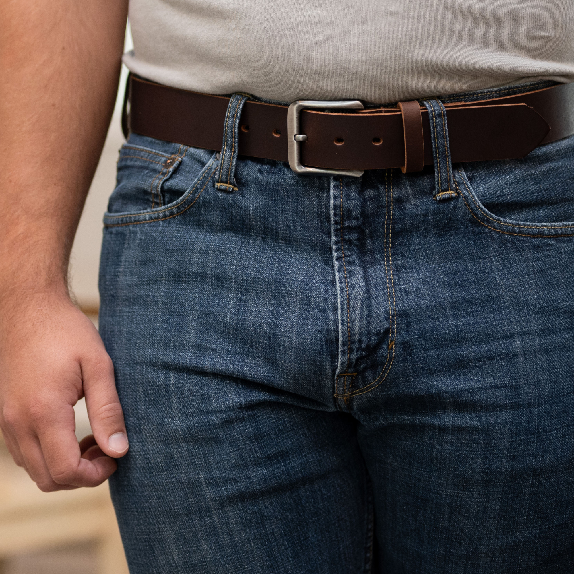 Roan mountain belt on model. zinc alloy belt buckle that is curved rectangular. 