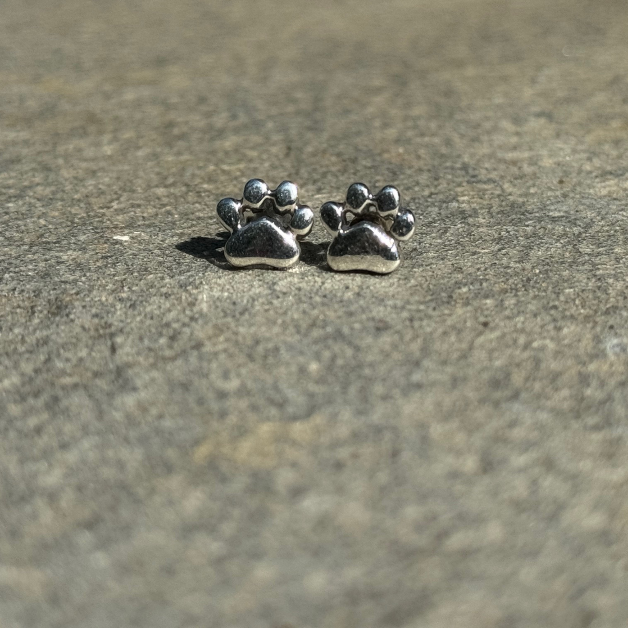 Pawsitively Perfect Paw Earrings by Nickel Smart. Shiny sterling silver dog or cat pawprint studs.