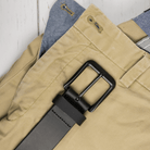 Image of Black Mountain Leather Belt on top of khaki pants. Black buckle with black leather strap