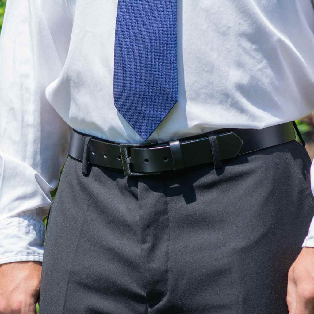 Black Leather belt with black carbon fiber buckle on model wearing professional attire. Pilot Belt