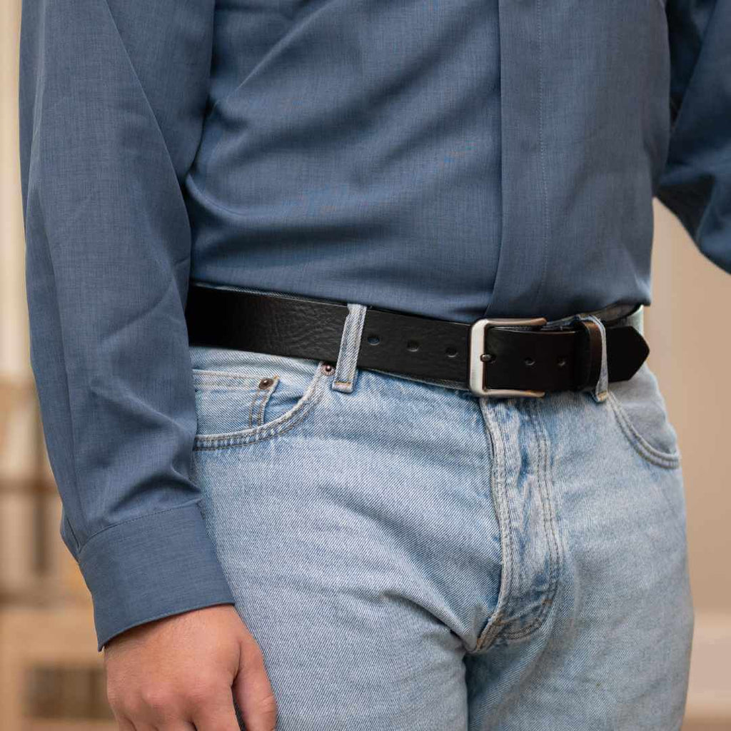 New River Black Leather Belt on model wearing blue shirt and blue jeans. Hypoallergenic.
