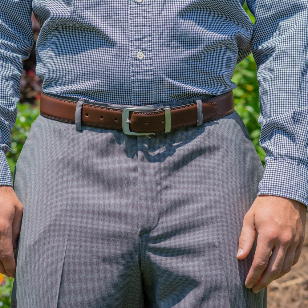 Brown Dress belt on a male model in a button-up shirt and slacks.