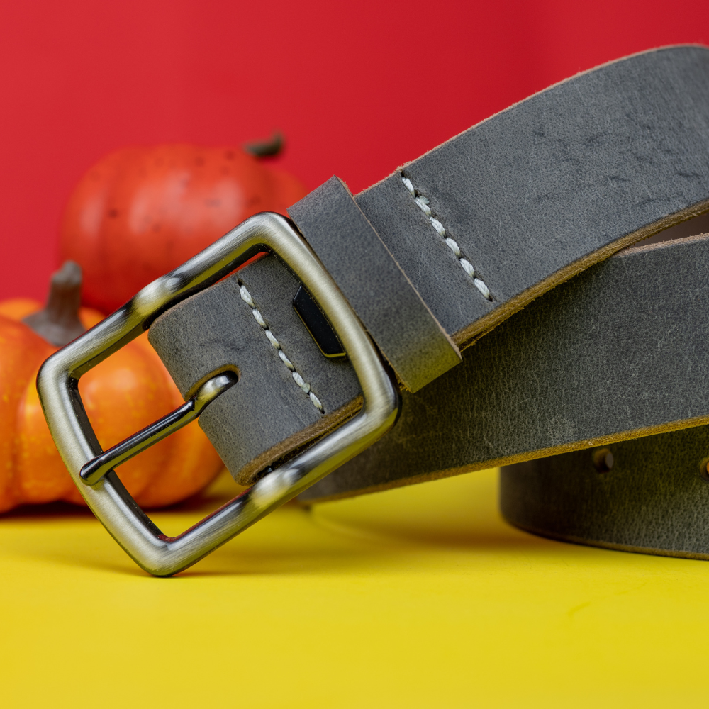 Cold Mountain Gray Belt coiled and with a yellow and orange background.