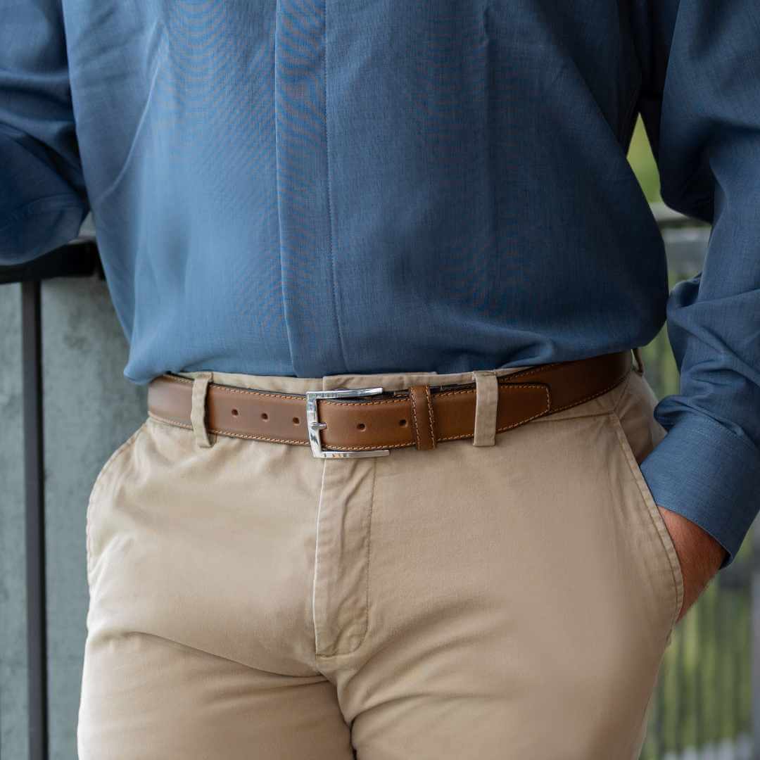 Model wearing Uptown Tan Dress Belt. Buckle is square, silver, shiny and nickel free.