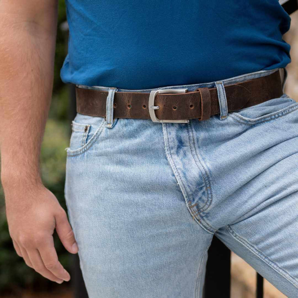 Distressed leather belt with low profile silver buckle. 1.5 inch strap. Nickel Free Buckle