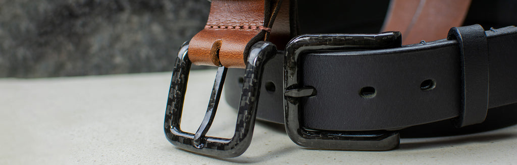 Image of Black and Brown leather belts with black carbon fiber buckles.  TSA Friendly. No Metal. Nickel Free
