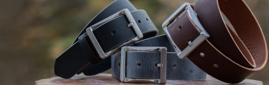 Image of a black leather belt, brown leather belt and gray leather belt.  All full grain leather with titanium work buckles.