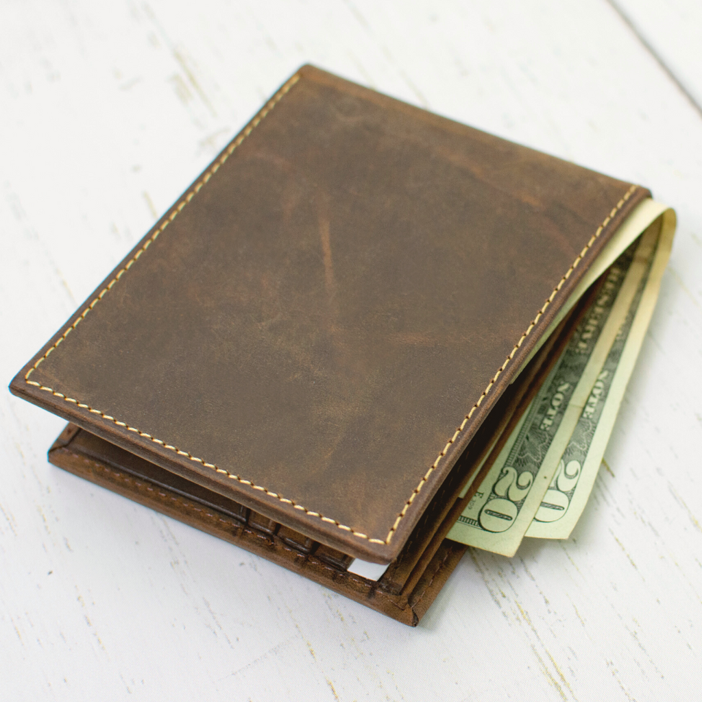 Randolph bifold wallet shown in use with cash in cash pocket (at the top)