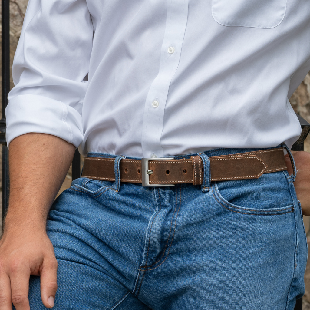Image of Caraway Mountain Stitched Belt.  Distressed Brown Leather with single cream colored stitching on the edges for decoration.  Silver nickel free buckle.