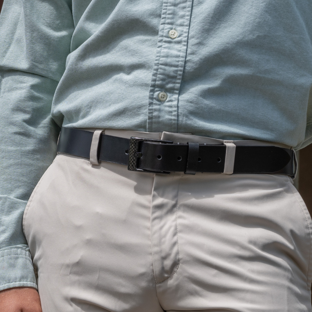 The Classified Black Leather Belt on model in khakis. 1⅜" or 35mm wide. Dress-casual or dress belt.