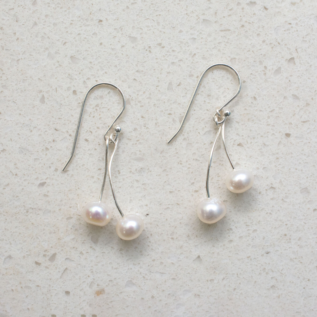 Twinleaf Freshwater Pearls Dangle Earrings. Each earring has 2 pearls on independent swinging wires.