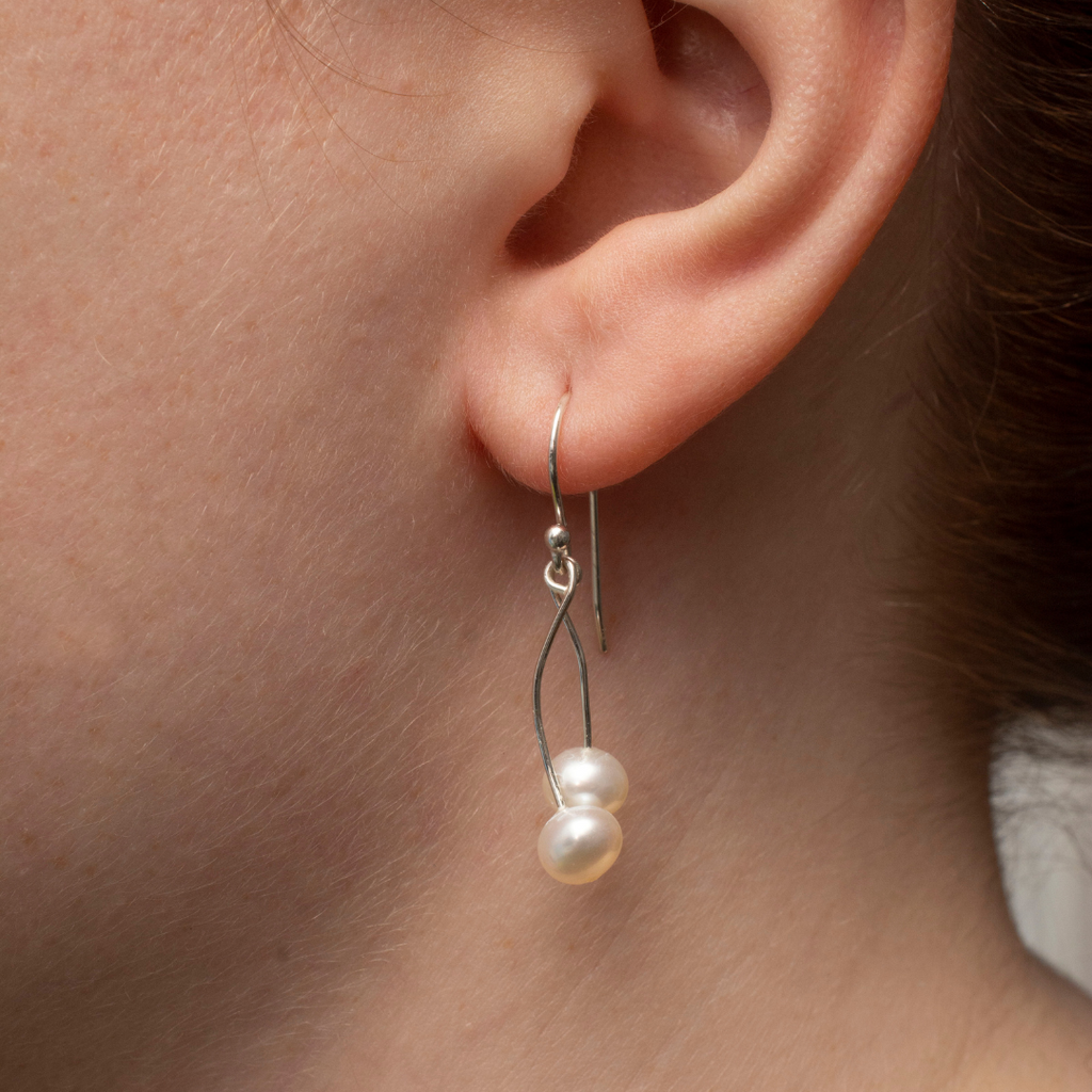 2 freshwater white pearls per earring. Sterling Silver Nickel Free French hooks.  Dangle Earrings