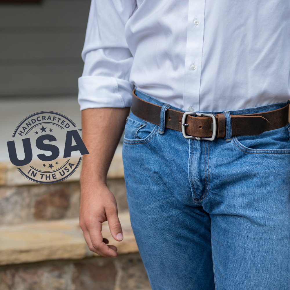 Rocky River Distressed Brown Belt on model. Handcrafted in the USA. Strap is 1.5 inches wide.