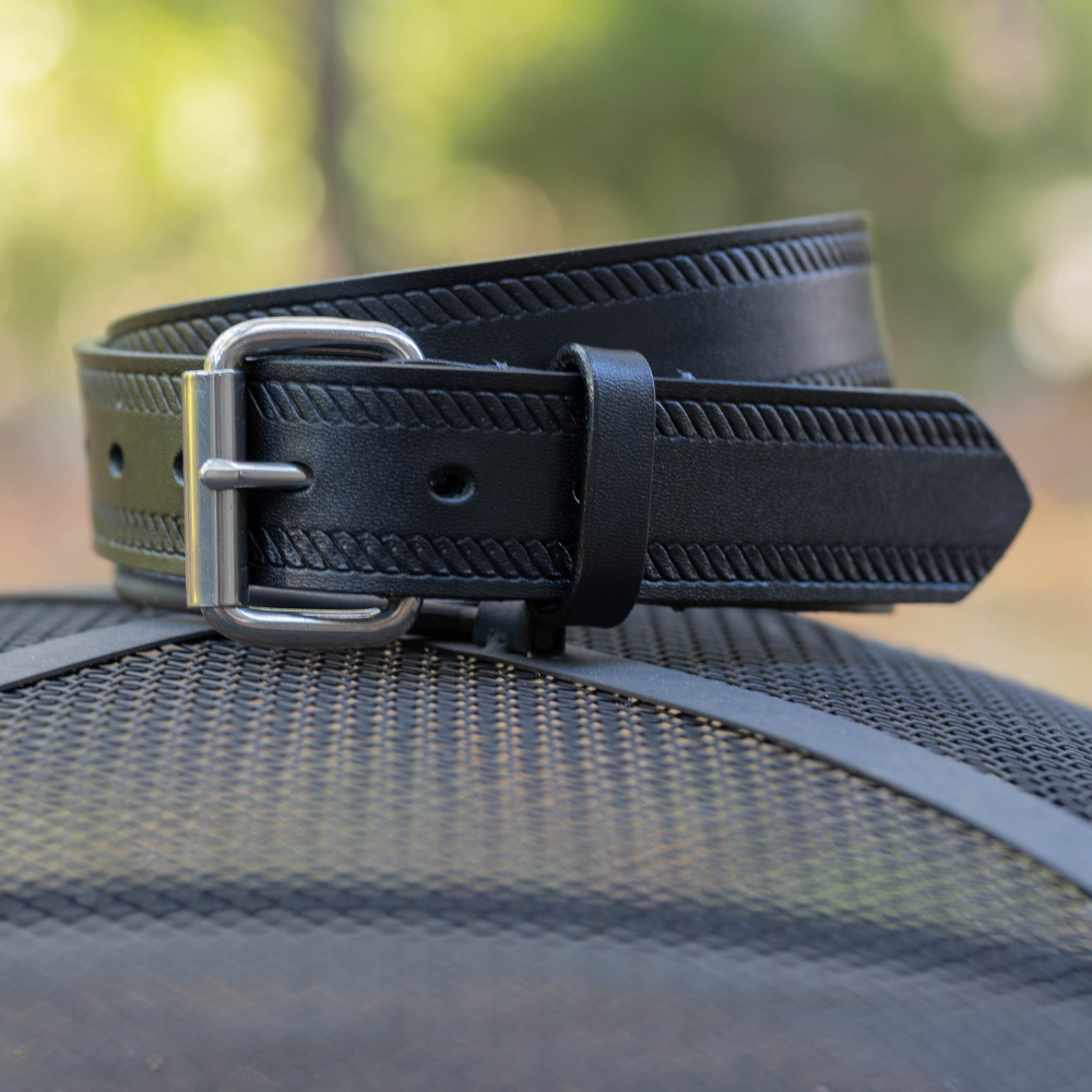 Black Rope Belt. Stainless steel buckle; glossy black strap with embossed design. Roller buckle