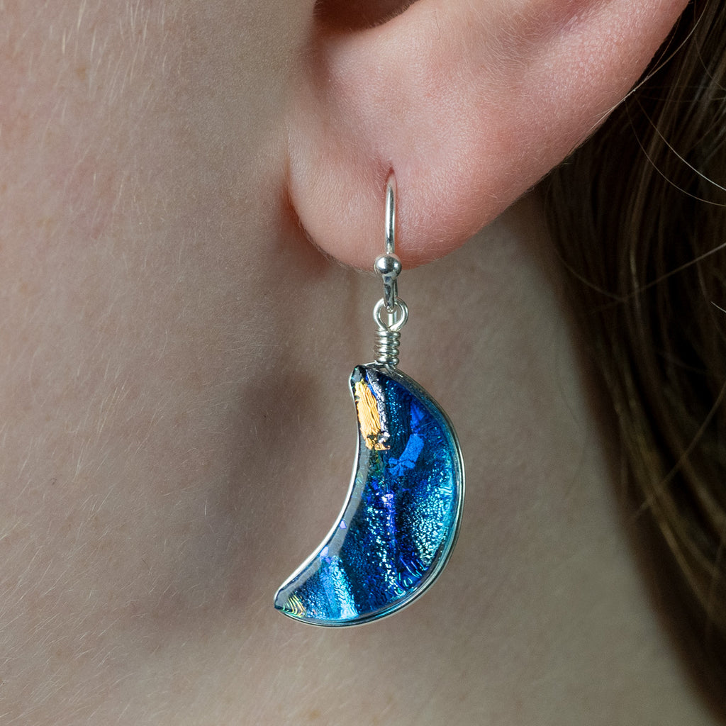 Blue Moon Dichroic Glass Earrings on model. This pair is mostly blue and silver; approx. 1.5" long.