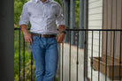 Caraway Mountain Distressed Brown Leather Belt on model in jeans. Casual belt with raw edges.