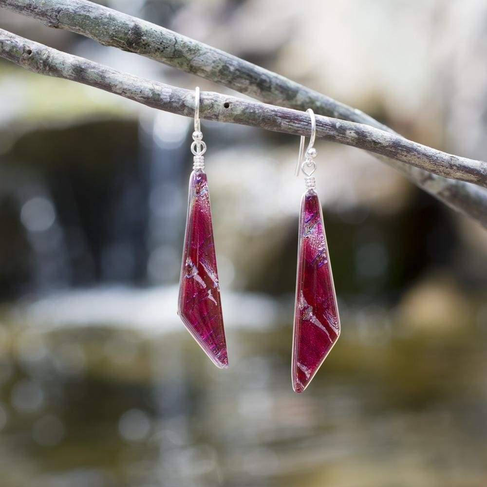Merry Waterfalls Earrings. Outdoor setting. Dichroic glass dangles, predominantly pink and silver.