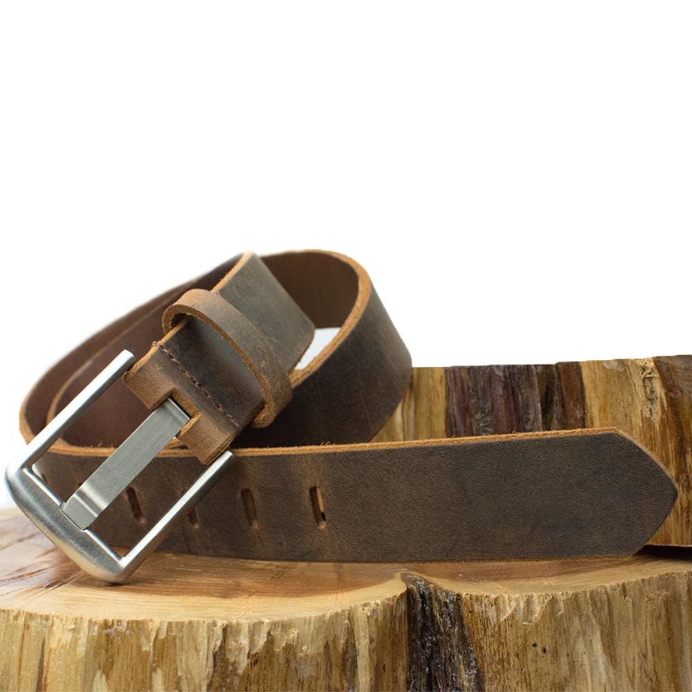 Titanium Wide Pin Distressed Leather Belt on wooden pedestal. Unique casual style. Wide pin buckle.